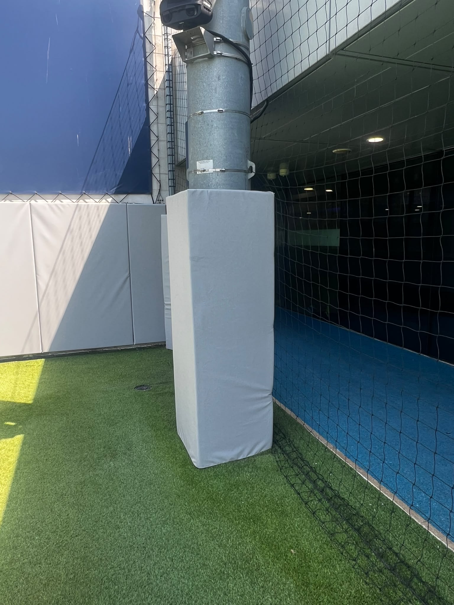 Bespoke protective padding fitted around a steel support column