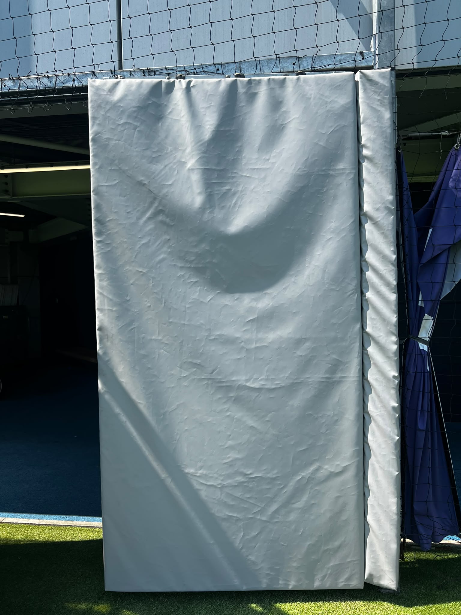 Bespoke protective padding installed within a professional training facility