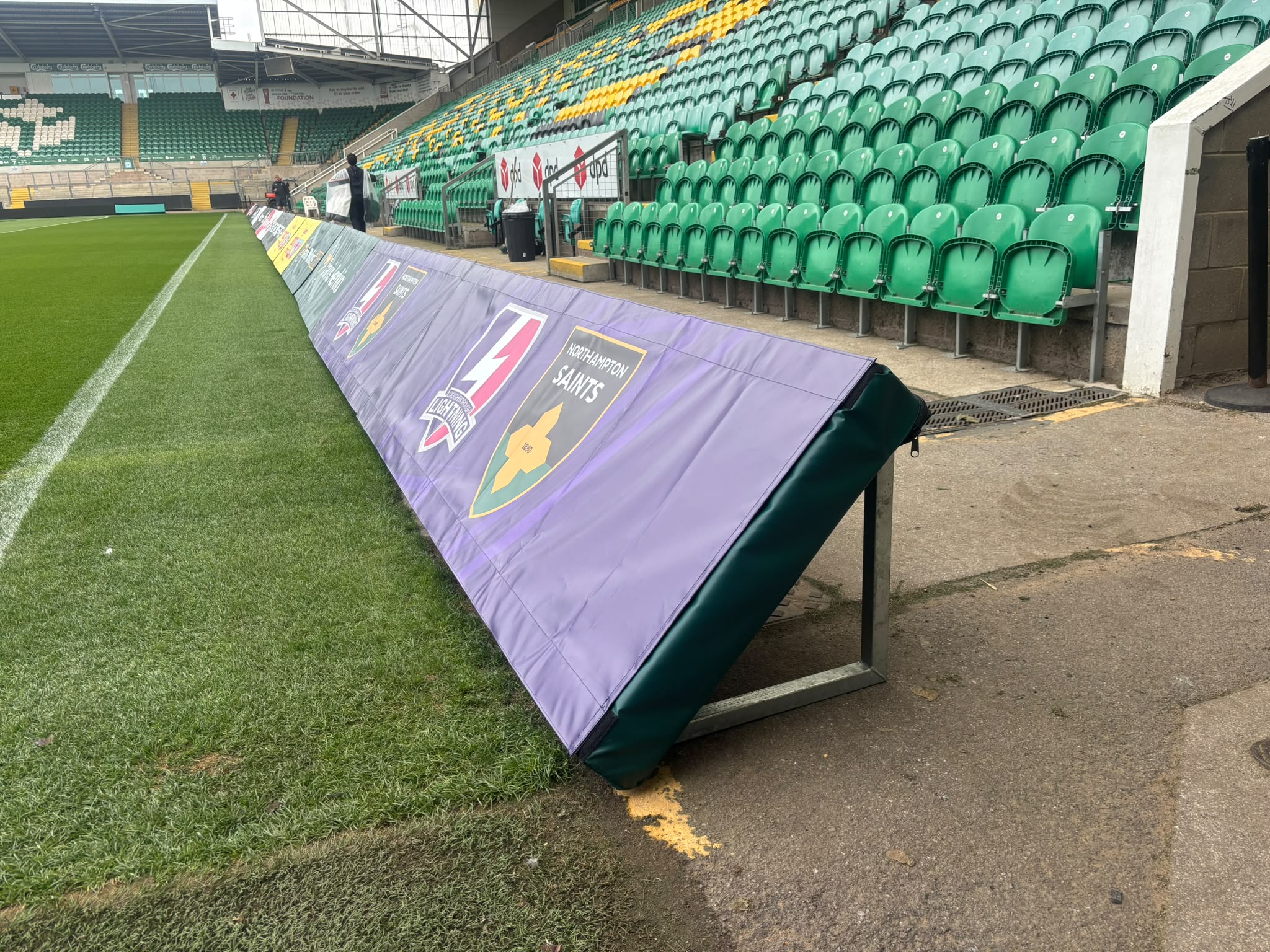 Sponsored padding installed around the rugby pitch