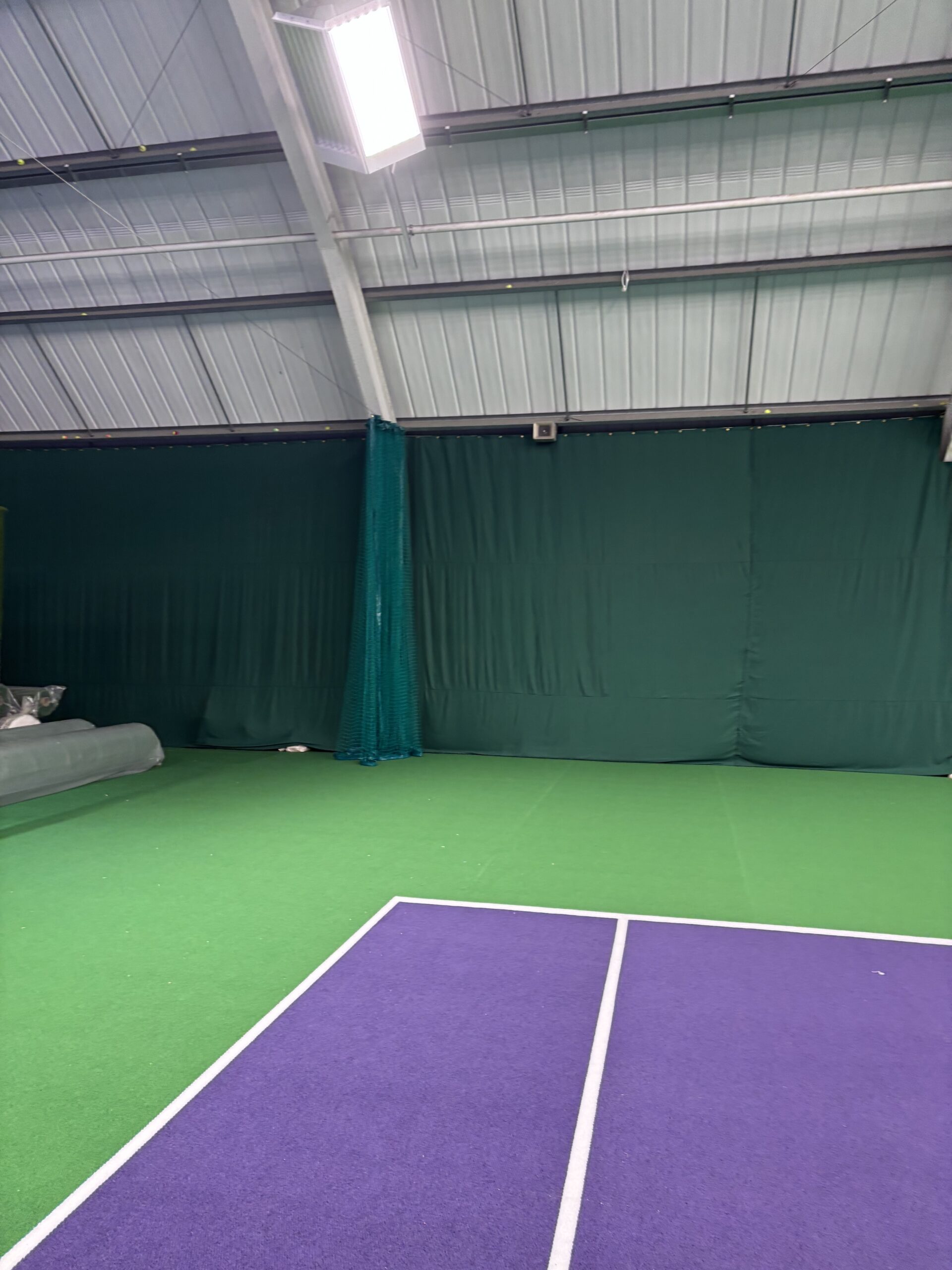Indoor court backdrop curtains at Tennis World Middlesbrough