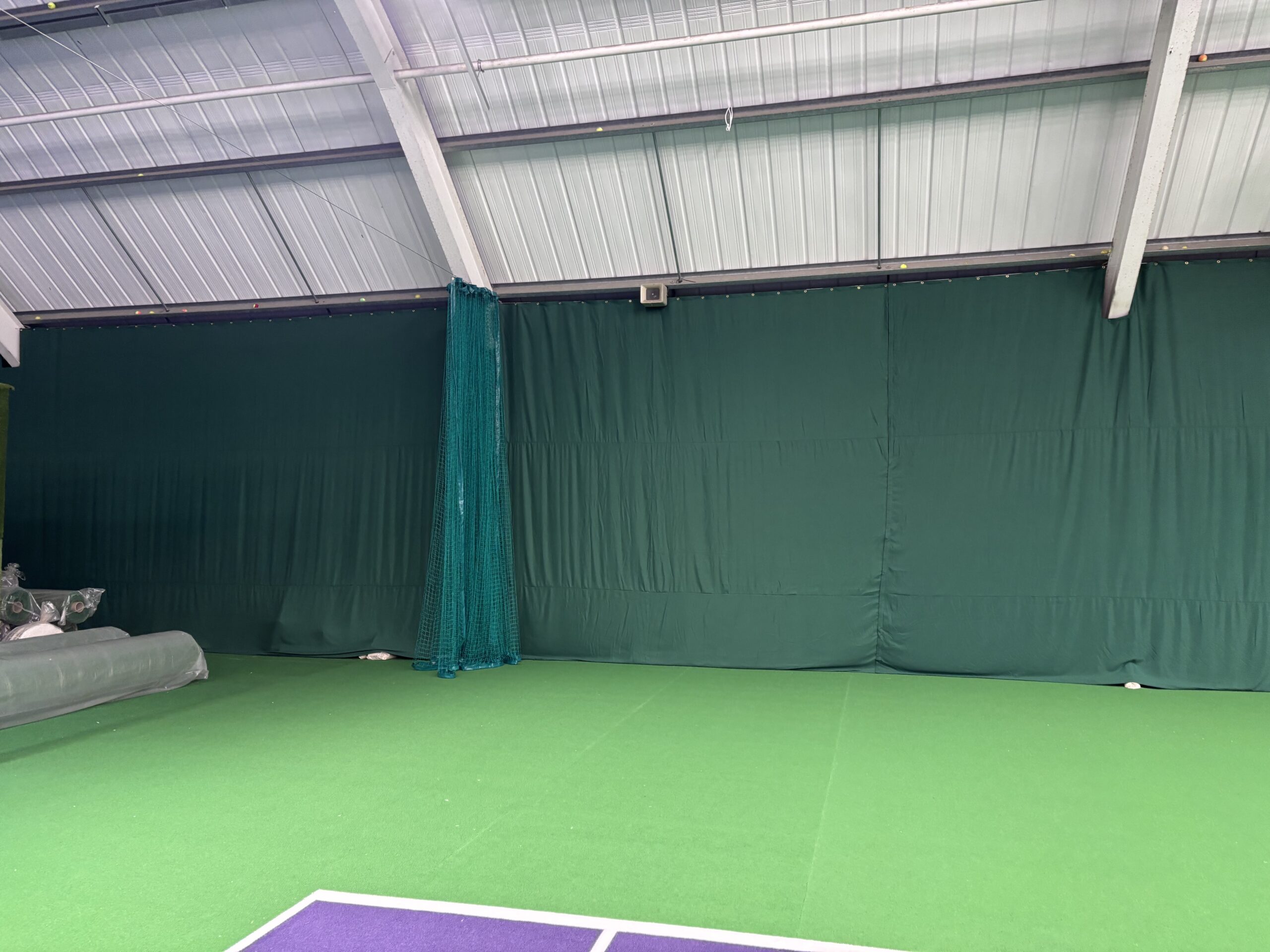 Bespoke indoor tennis court screening