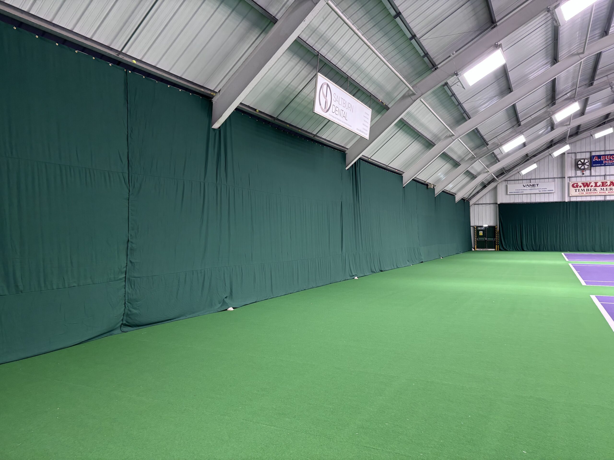 Indoor tennis backdrops and divider netting installed at Tennis World Middlesbrough