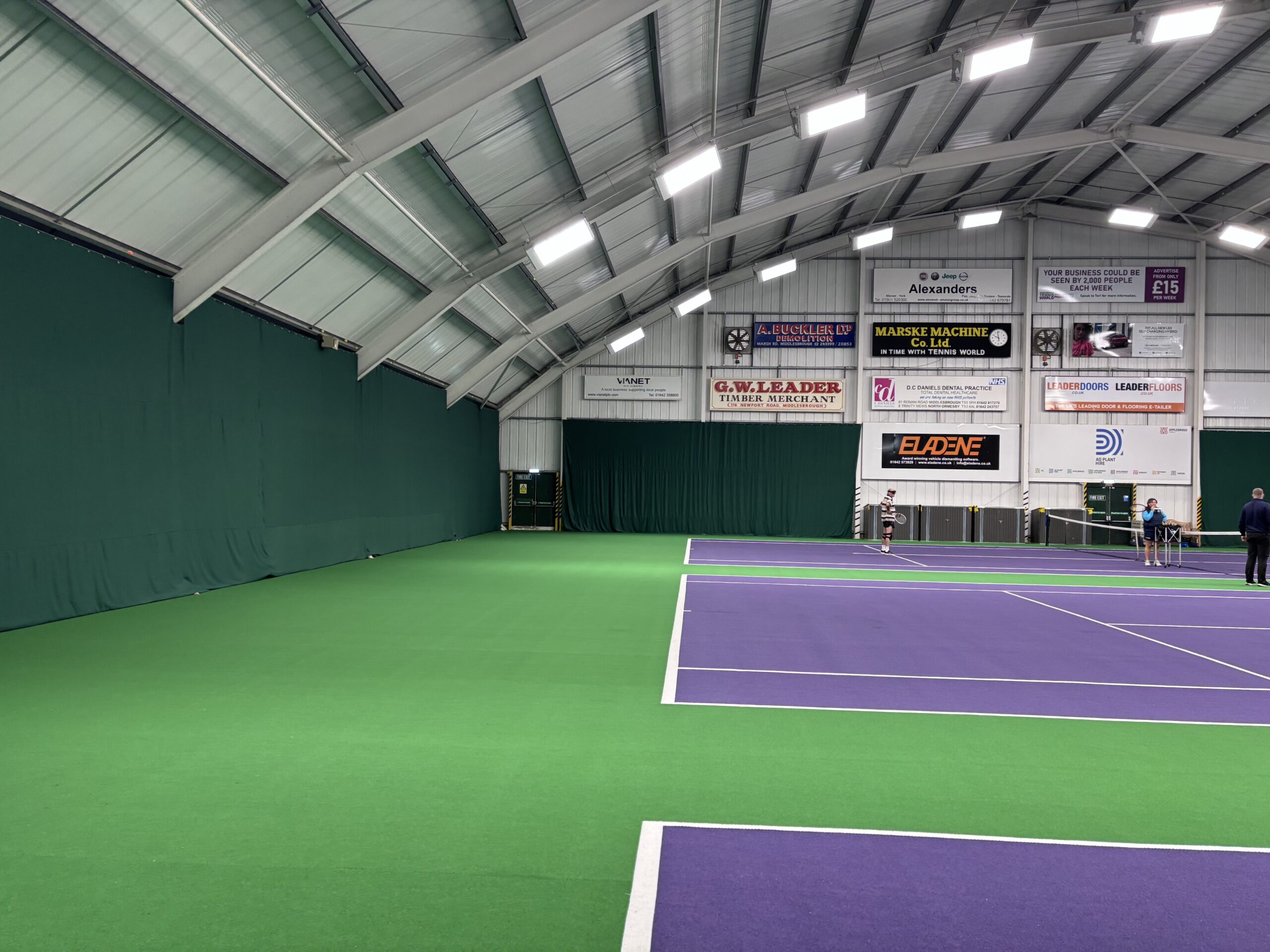 Green indoor tennis backdrop curtains installed at Tennis World Middlesbrough